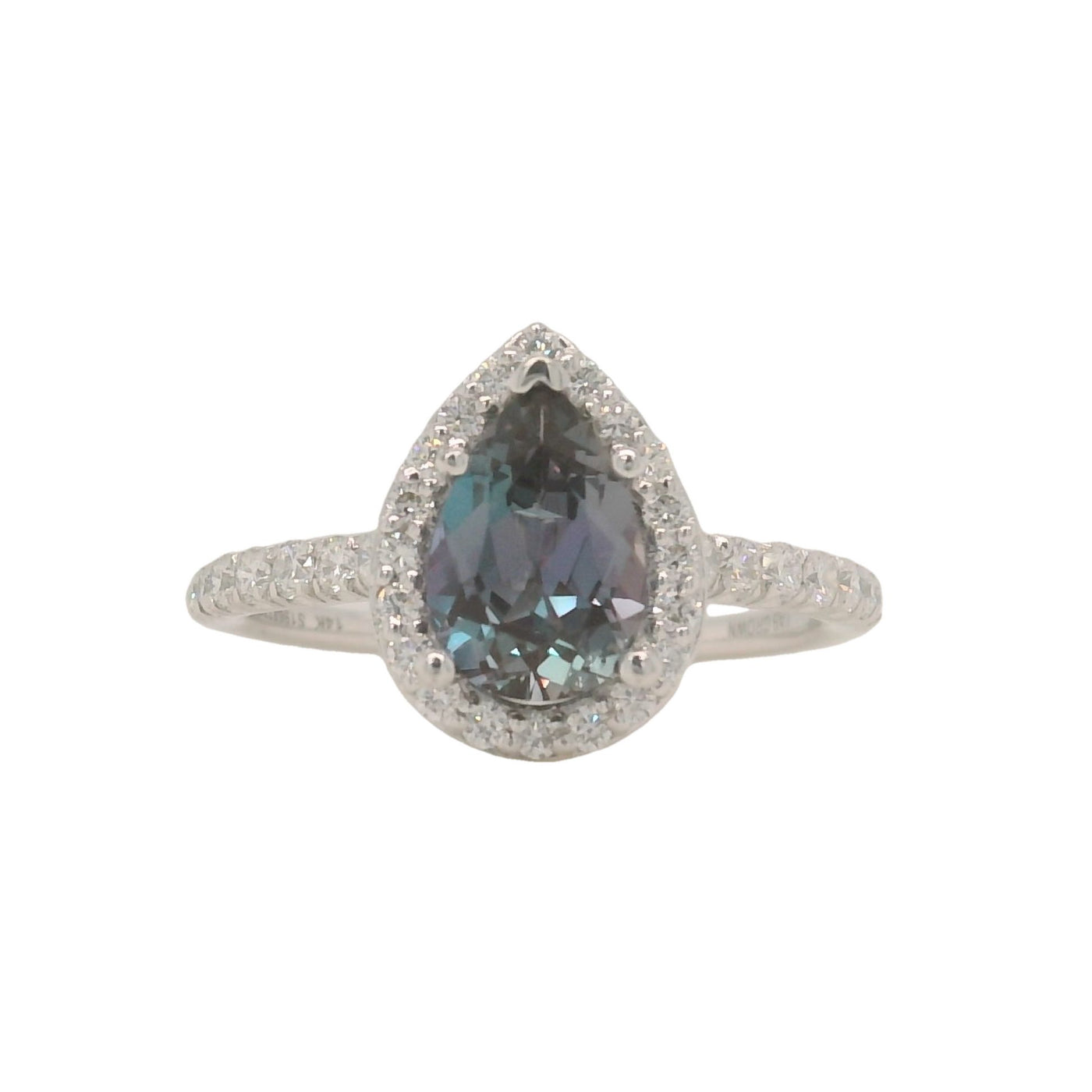 white gold lab grown pear alexandrite engagement ring with halo and accent diamonds