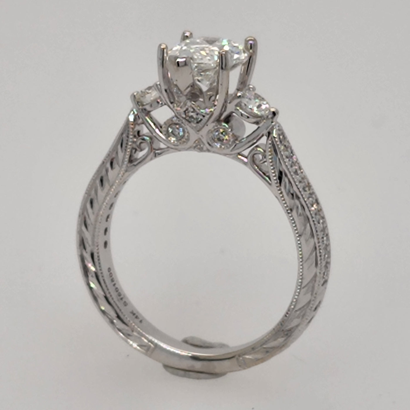 White Gold Engagement Ring With Pear Diamond Center and Accent Diamonds