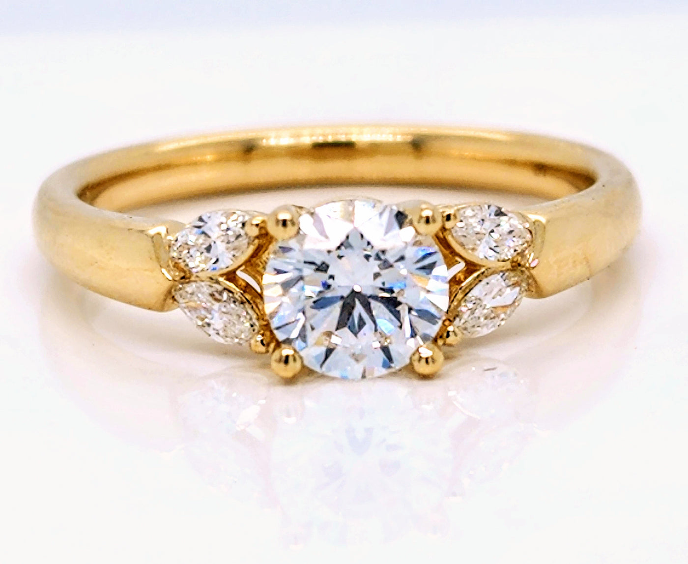 Yellow Gold Engagement Ring With Round Center Stone And Marquise Accents