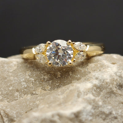 Yellow Gold Engagement Ring With Round Center Stone And Marquise Accents