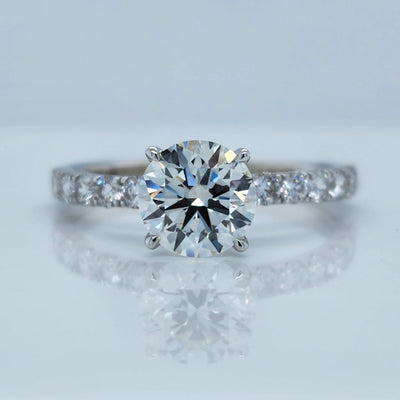 White Gold Engagement Ring With Round Diamond and Round Accents