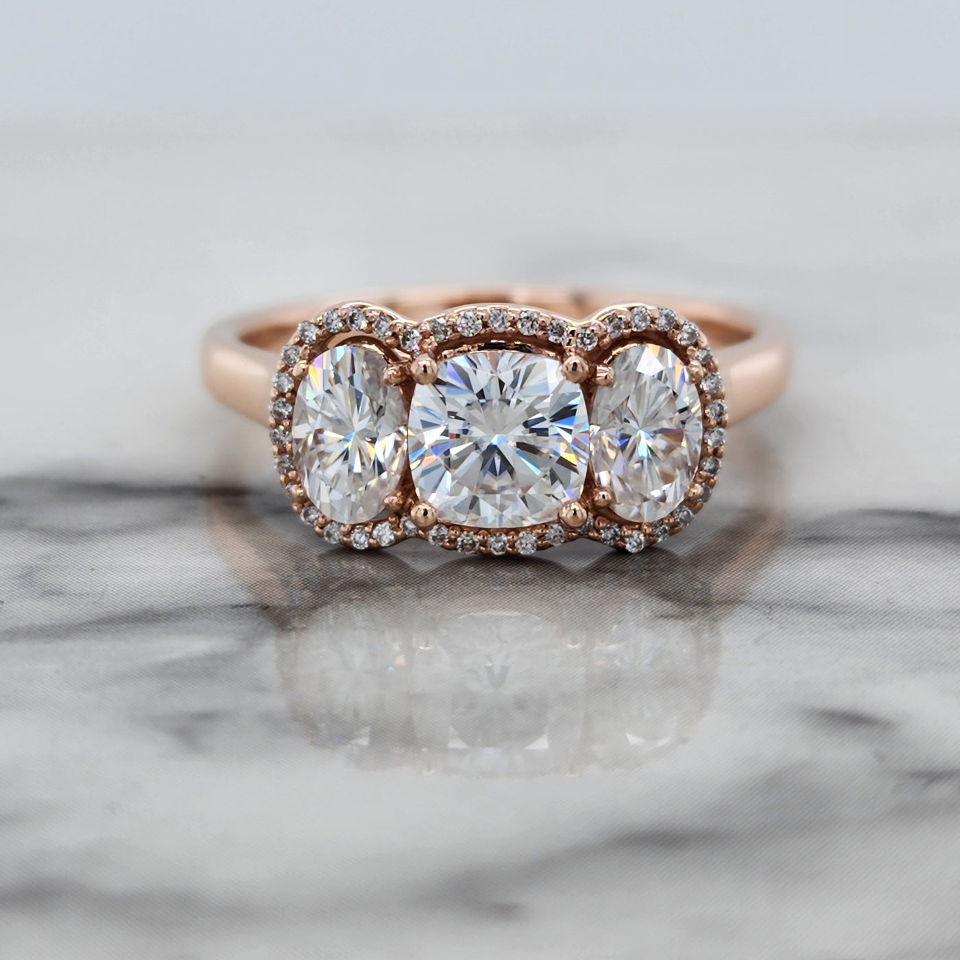 Rose Gold 3 Stone Engagement Ring With Cushion and Oval Moissanites