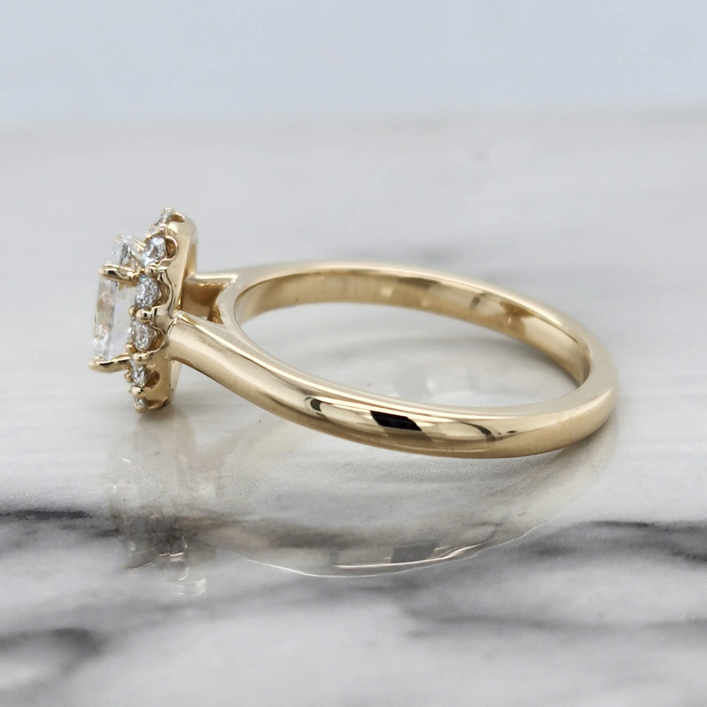Yellow Gold Engagement Ring With Oval Center And Halo