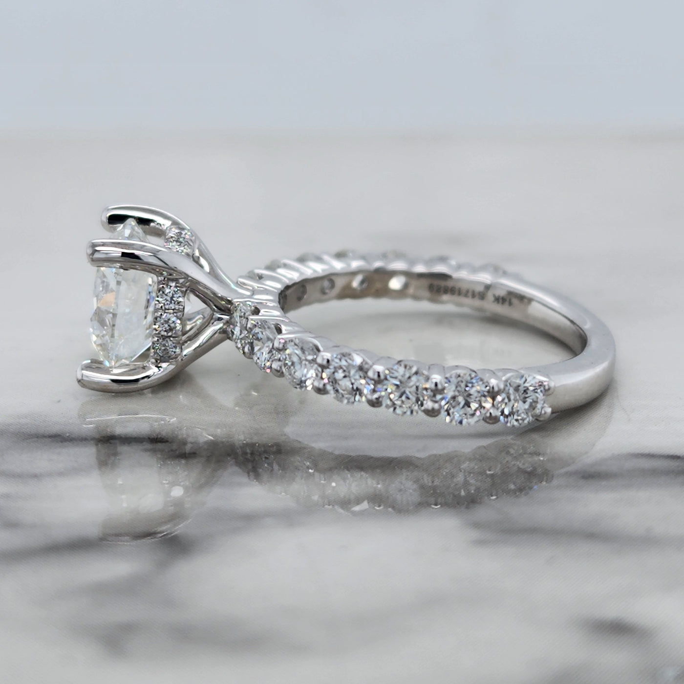 White Gold Engagement Ring With Round Center Stone and Hidden Halo