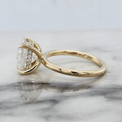 Yellow Gold Solitaire Engagement Ring With Oval Center and Hidden Halo