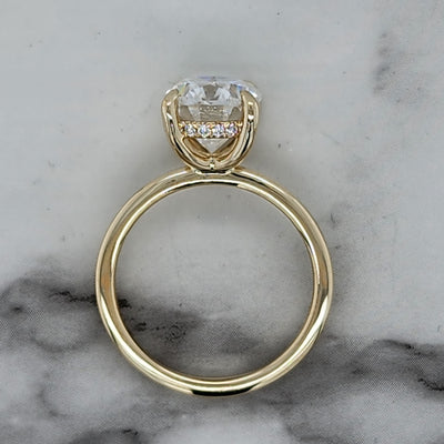 Yellow Gold Solitaire Engagement Ring With Oval Center and Hidden Halo