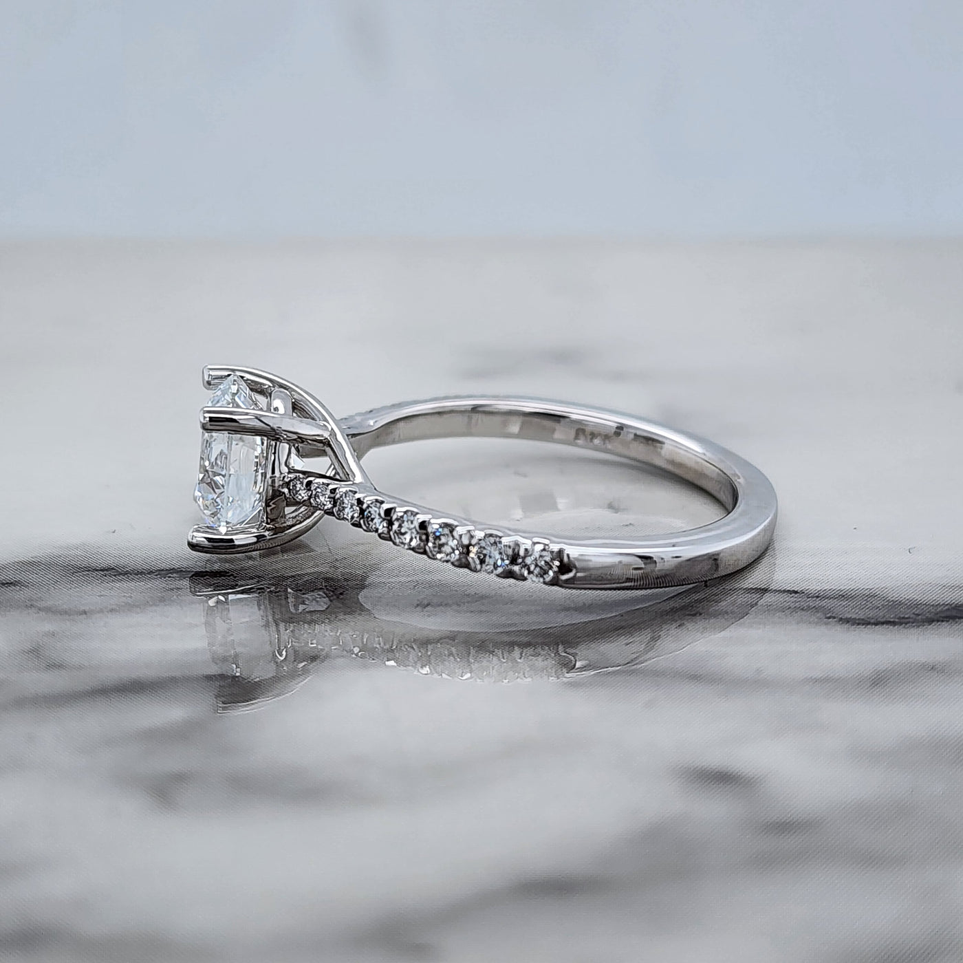 White Gold Engagement Ring With Round Center and Round Accent Stones