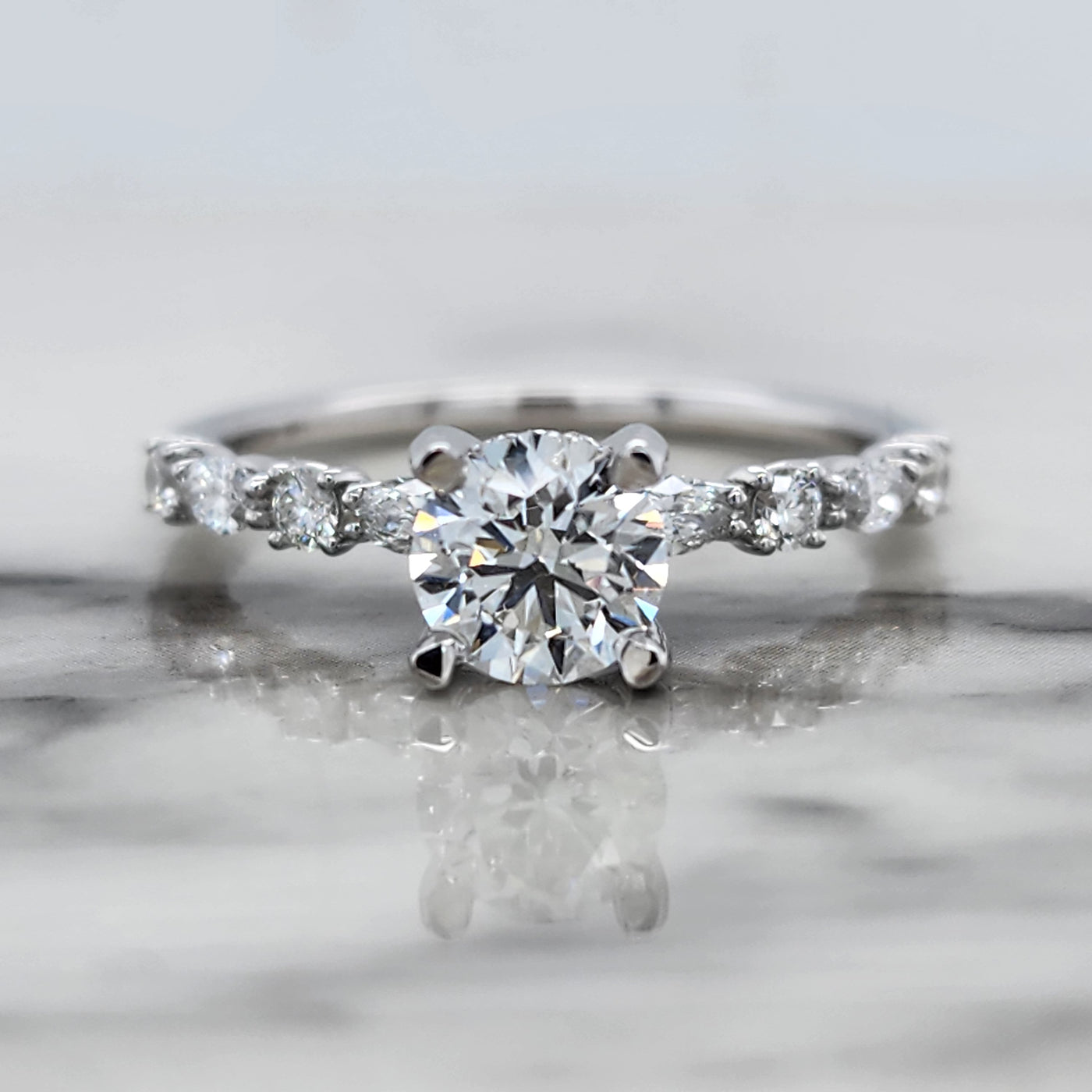 White Gold Engagement Ring With Round Center and Round and Marquise Accent Stones