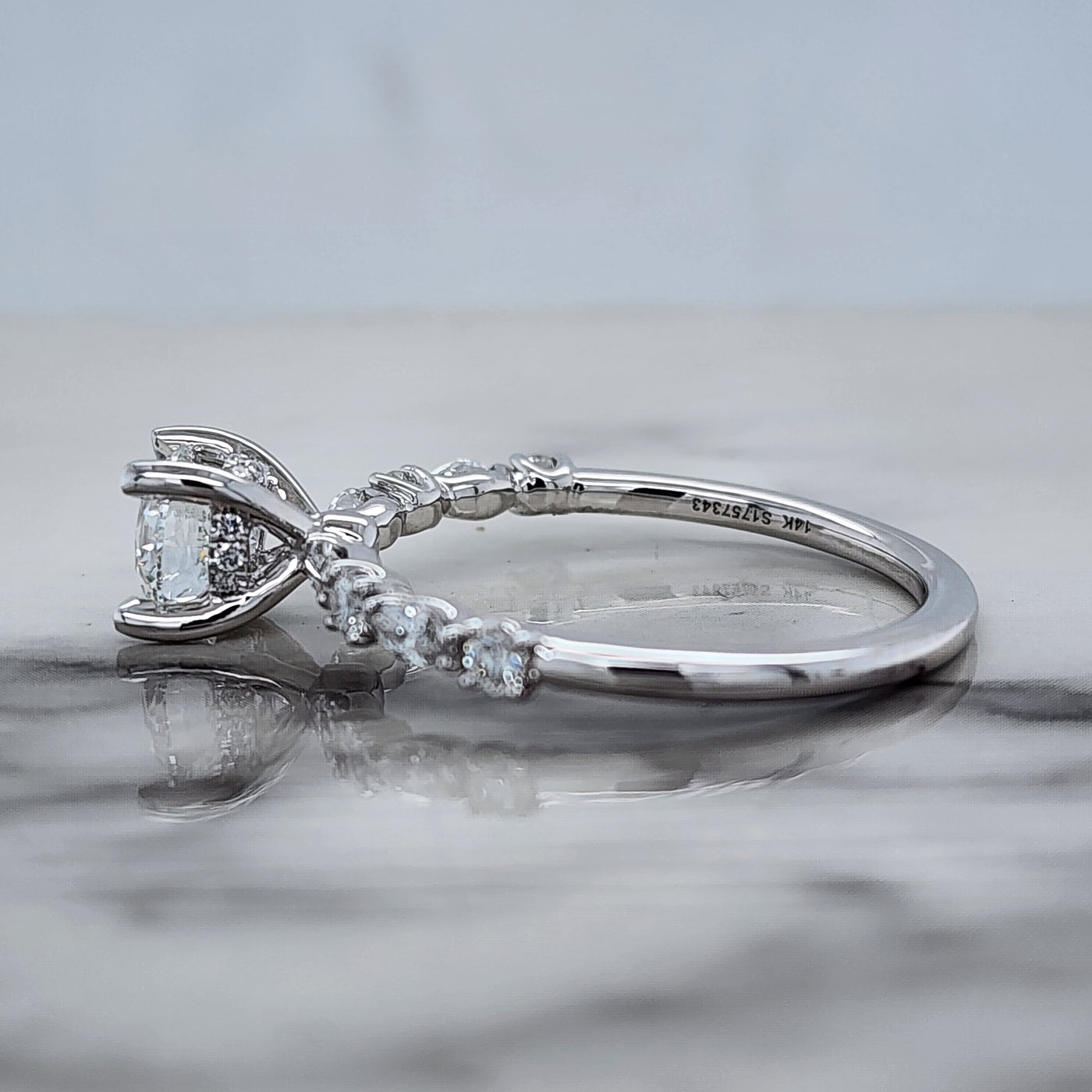 White Gold Engagement Ring With Round Center and Round and Marquise Accent Stones