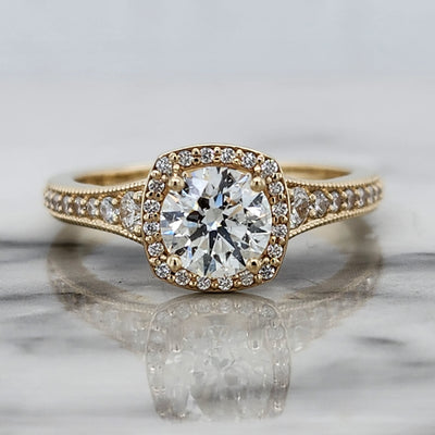 Yellow Gold Engagement Ring With Round Center Stone, Round Accents, and Cushion Halo