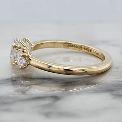 Yellow Gold 3 Stone Engagement Ring With Oval Center and Round Accents