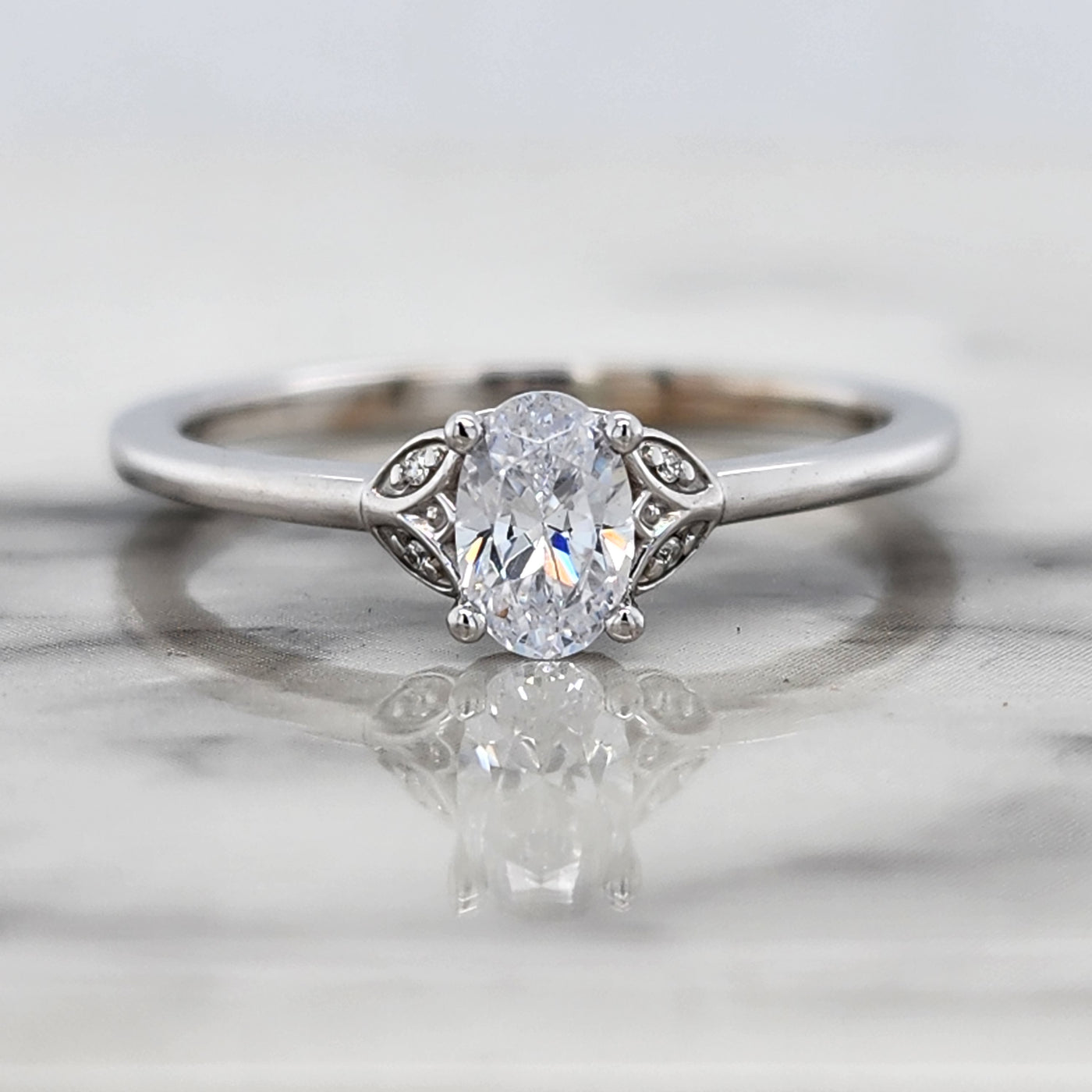 Dainty White Gold Engagement Ring With Oval Center