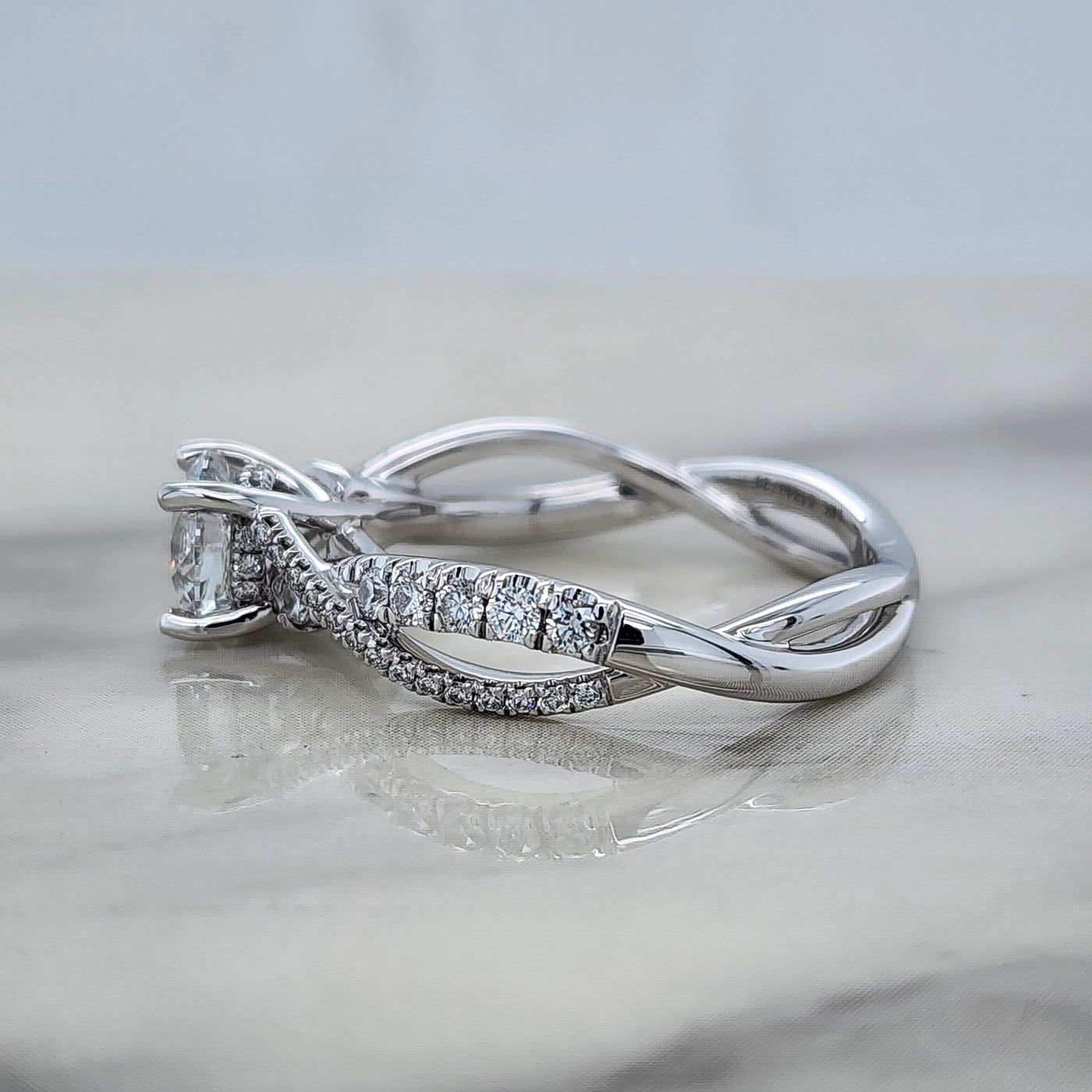 Twisted White Gold Round Engagement Ring With Round Diamond Accents