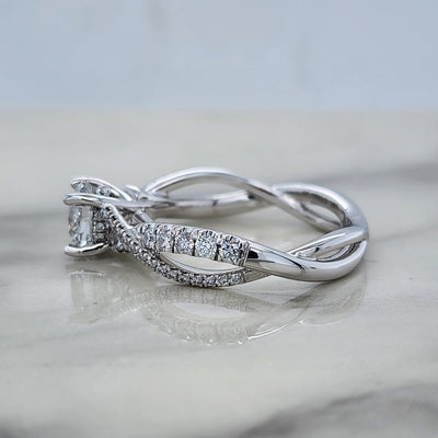 Twisted White Gold Round Engagement Ring With Round Diamond Accents