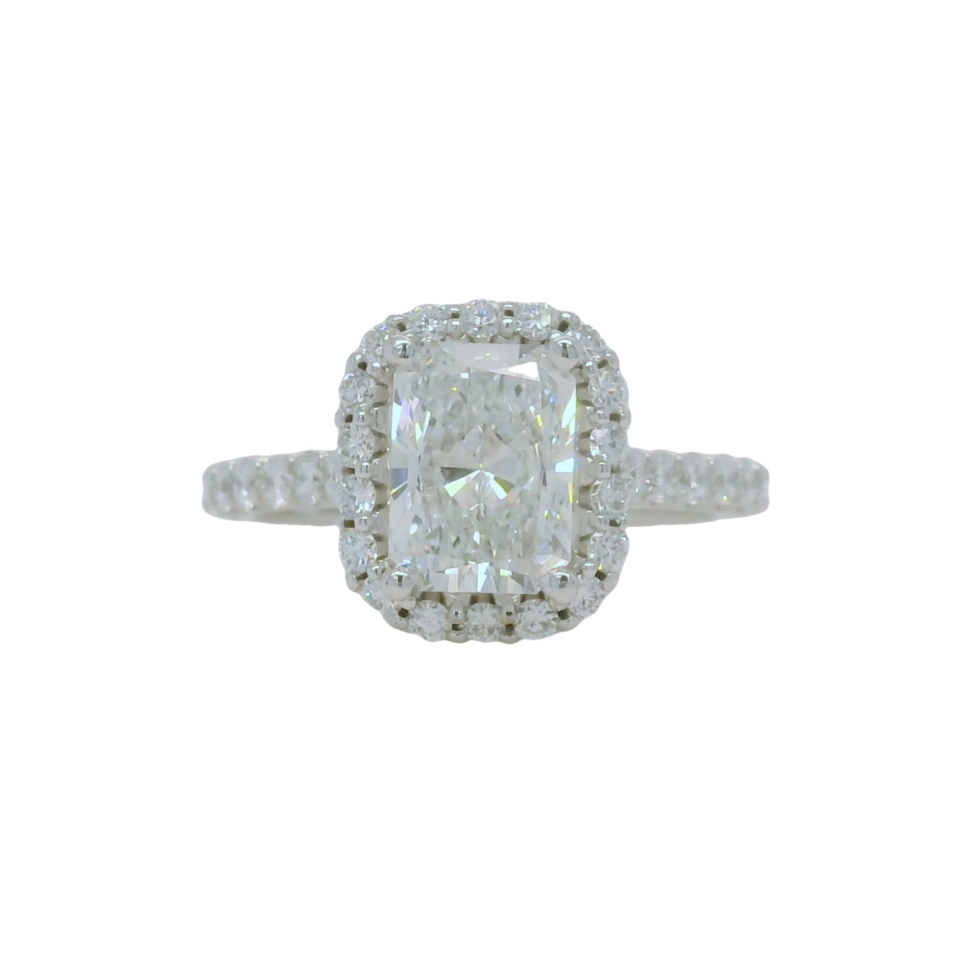 white gold radiant cut engagement ring with halo and accent diamonds