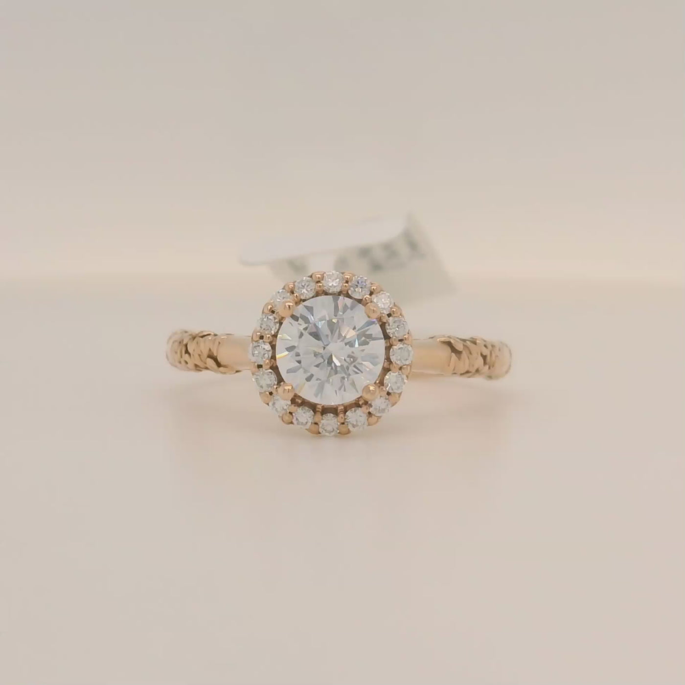 rose gold round engagement ring with halo