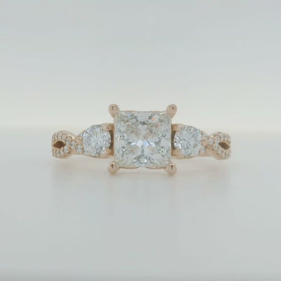 rose gold princess cut engagement ring with round accent diamonds